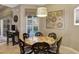 Dining area with stone table and unique chairs with view to pool at 2442 Heritage Green Ave, Davenport, FL 33837
