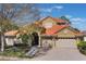 Stunning two-story home boasts a terracotta roof, three-car garage, and lush landscaping at 2442 Heritage Green Ave, Davenport, FL 33837