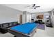 Spacious game room complete with pool table, media center, and comfortable seating at 2442 Heritage Green Ave, Davenport, FL 33837