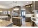 Spacious kitchen featuring stainless steel appliances, granite countertops, and gray cabinetry at 2442 Heritage Green Ave, Davenport, FL 33837