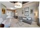 Stylish living room featuring elegant decor, tile flooring, and ample seating at 2442 Heritage Green Ave, Davenport, FL 33837