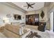 Bright living room featuring a fireplace, a ceiling fan, recessed lighting, and a large built-in entertainment center at 2442 Heritage Green Ave, Davenport, FL 33837