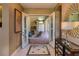 Entryway with open doorway to a patio with grill and outdoor seating at 2442 Heritage Green Ave, Davenport, FL 33837
