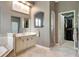 Bathroom featuring a marble countertop, walk-in shower, and large vanity at 2442 Heritage Green Ave, Davenport, FL 33837