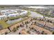 Community of townhomes around lakes, lush landscaping, and amenities at 3185 Pequod Pl, Kissimmee, FL 34746