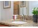 Close up on bathroom sink with granite countertop, providing a spa-like aesthetic at 3185 Pequod Pl, Kissimmee, FL 34746