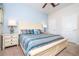 Bedroom showcasing the bed, dual nightstands, and plush carpeting at 3185 Pequod Pl, Kissimmee, FL 34746