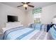 Bedroom featuring twin beds, TV and window with a floral valance at 3185 Pequod Pl, Kissimmee, FL 34746