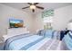 Bedroom with twin beds, TV and window with a floral valance at 3185 Pequod Pl, Kissimmee, FL 34746