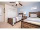 Comfortable bedroom featuring two twin beds, ceiling fan, closet and light blue accent wall at 3185 Pequod Pl, Kissimmee, FL 34746