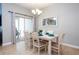 Cozy dining area with seating for six and sliding glass doors to the outdoor patio at 3185 Pequod Pl, Kissimmee, FL 34746