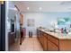 Modern kitchen featuring stainless steel appliances, granite countertops, and ample cabinet space at 3185 Pequod Pl, Kissimmee, FL 34746