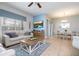 Bright living room featuring comfortable seating, a large window, and an adjacent dining area, perfect for relaxation at 3185 Pequod Pl, Kissimmee, FL 34746
