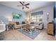 Comfortable living room with two sofas, a ceiling fan, and stylish decor at 3185 Pequod Pl, Kissimmee, FL 34746