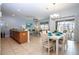 Open-concept living space with dining area, modern kitchen, and comfortable seating, perfect for Gathering gatherings at 3185 Pequod Pl, Kissimmee, FL 34746