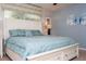 Bright bedroom featuring a comfortable bed, ceiling fan, and tasteful wall art at 3185 Pequod Pl, Kissimmee, FL 34746