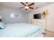 Cozy bedroom featuring a plush bed, ceiling fan, and a stylish white dresser at 3185 Pequod Pl, Kissimmee, FL 34746
