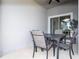 Cozy outdoor dining area with a table and four chairs, perfect for enjoying meals at 3185 Pequod Pl, Kissimmee, FL 34746