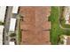 Top-down aerial shot of the building's roof, parking area, and landscaping at 3301 Whitestone Cir # 204, Kissimmee, FL 34741