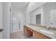 Bathroom with double granite vanity, tile floor, and glass-enclosed shower at 3301 Whitestone Cir # 204, Kissimmee, FL 34741