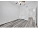 A bedroom with wood-look floors and a closet, offering ample storage at 3301 Whitestone Cir # 204, Kissimmee, FL 34741