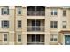 Exterior shot of the building featuring multiple balconies and large windows at 3301 Whitestone Cir # 204, Kissimmee, FL 34741
