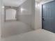 Condo hallway with neutral paint and carpeting leading to unit entry door; exit sign visible at 3301 Whitestone Cir # 204, Kissimmee, FL 34741