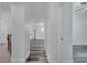 Hallway view shows modern wood floors and access to various rooms at 3301 Whitestone Cir # 204, Kissimmee, FL 34741