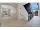 Open hallway leading to stairwell with natural light and neutral, modern decor at 3301 Whitestone Cir # 204, Kissimmee, FL 34741