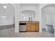 Spacious kitchen with a stainless steel dishwasher, granite counters, and wood cabinets at 3301 Whitestone Cir # 204, Kissimmee, FL 34741