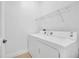 Laundry room features a white dryer with wire shelving above at 3301 Whitestone Cir # 204, Kissimmee, FL 34741