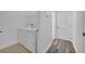 Laundry room features a white washer and dryer set with wire shelf above at 3301 Whitestone Cir # 204, Kissimmee, FL 34741