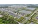 Aerial view of a housing development with community ponds, well-kept lawns, and orderly streets at 3493 Lazy River Ter, Sanford, FL 32771