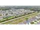 Aerial view of a community lined by drainage canals, featuring modern homes with well-manicured lawns at 3493 Lazy River Ter, Sanford, FL 32771