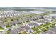 Panoramic aerial view of a residential community with houses, streets, ponds, and green spaces in a planned layout at 3493 Lazy River Ter, Sanford, FL 32771