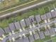 Aerial view of a neighborhood featuring well-maintained homes, green lawns, and a community drainage canal at 3493 Lazy River Ter, Sanford, FL 32771