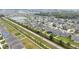 Aerial view of a housing development with community ponds, well-kept lawns, and orderly streets at 3493 Lazy River Ter, Sanford, FL 32771