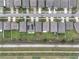 Aerial view of a neighborhood featuring well-maintained homes, green lawns, and a community drainage canal at 3493 Lazy River Ter, Sanford, FL 32771