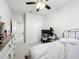 Cozy bedroom featuring a ceiling fan, carpeted floor and ample natural light at 3493 Lazy River Ter, Sanford, FL 32771