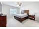 Bright bedroom with a headboard, dresser, and a view from the window at 3493 Lazy River Ter, Sanford, FL 32771