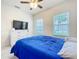 Bright bedroom with carpet, ceiling fan, and two windows at 3493 Lazy River Ter, Sanford, FL 32771