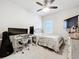 Bedroom features a wooden dresser, a ceiling fan, and a large desk at 3493 Lazy River Ter, Sanford, FL 32771