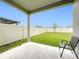 View from covered patio overlooking fenced backyard with green lawn, offering privacy at 3493 Lazy River Ter, Sanford, FL 32771