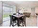 Dining area with sliding glass doors providing access to the outdoors at 3493 Lazy River Ter, Sanford, FL 32771