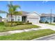 Charming single-story home with well-manicured lawn, lush landscaping, and a two-car garage at 3493 Lazy River Ter, Sanford, FL 32771