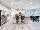 Bright eat-in kitchen featuring stainless steel appliances, a large island, and natural light at 3493 Lazy River Ter, Sanford, FL 32771