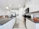 Functional kitchen layout with granite countertops, stainless steel appliances, and abundant storage at 3493 Lazy River Ter, Sanford, FL 32771