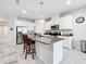 Spacious kitchen with an island, stainless steel appliances, and plenty of cabinet storage at 3493 Lazy River Ter, Sanford, FL 32771