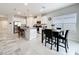 Spacious kitchen with stainless steel appliances, granite counters, and breakfast bar seating at 3493 Lazy River Ter, Sanford, FL 32771