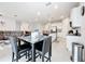 Open concept living space with kitchen, dining area, and living room at 3493 Lazy River Ter, Sanford, FL 32771